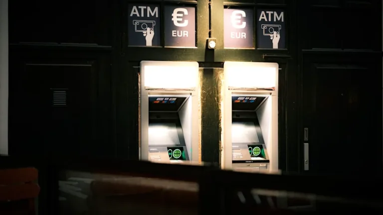 A couple of atm machines sitting next to each other