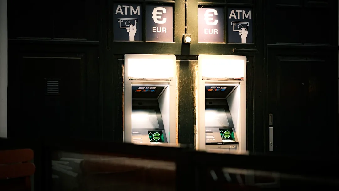 A couple of atm machines sitting next to each other
