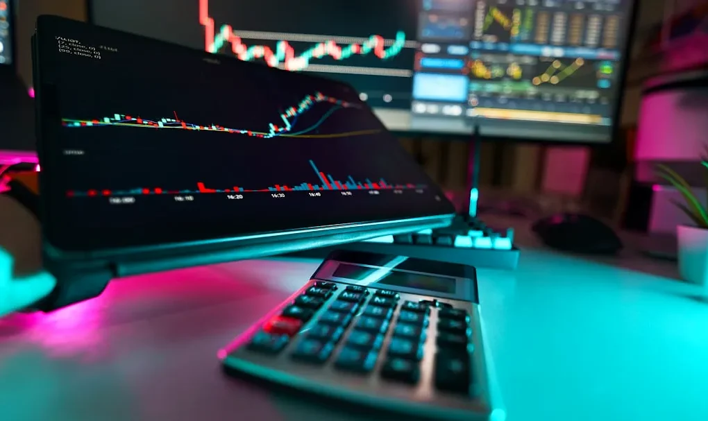 A desk with a keyboard and a monitor