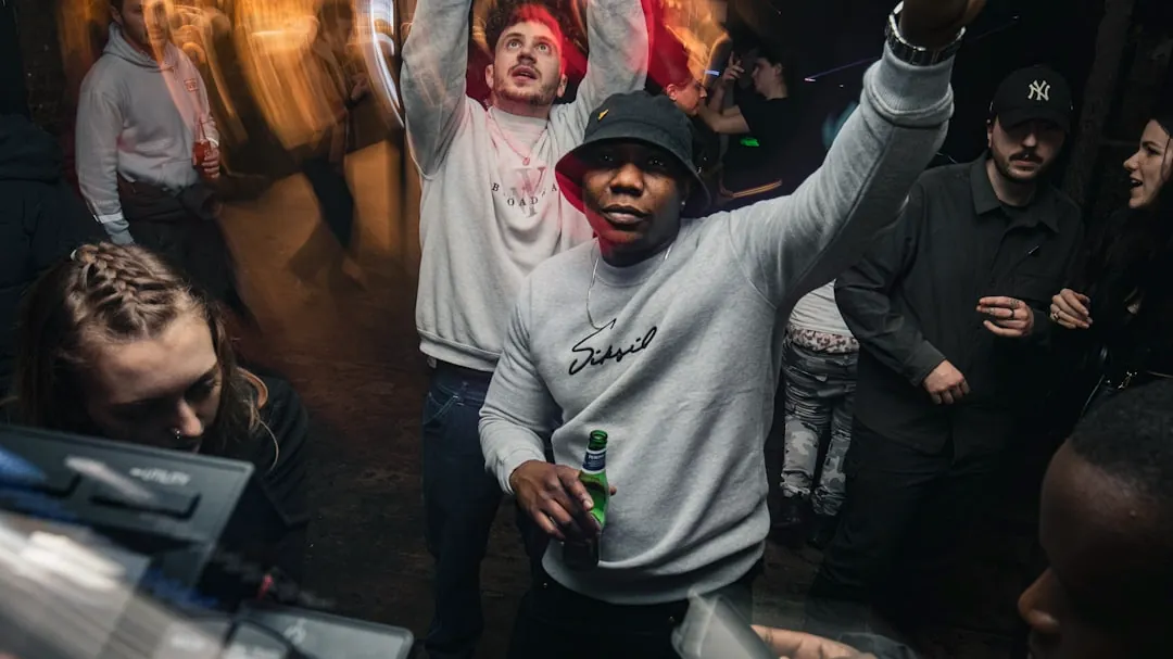 a group of people standing around each other