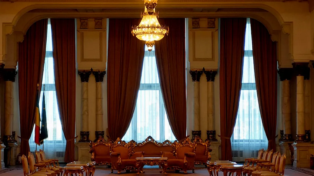 a large room with a chandelier hanging from the ceiling