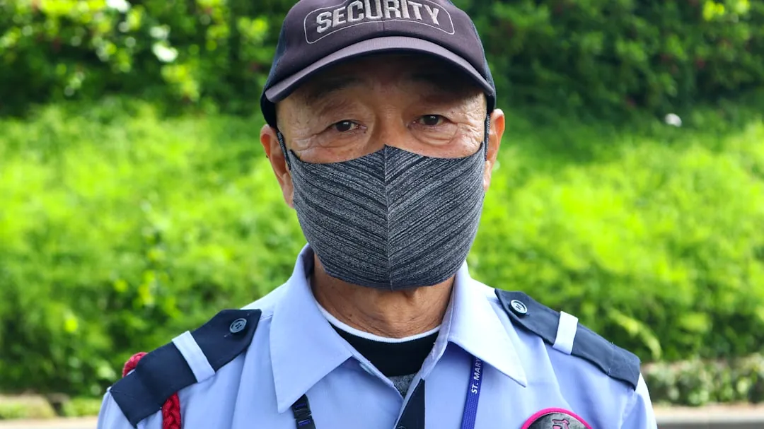 a man wearing a hat and a uniform