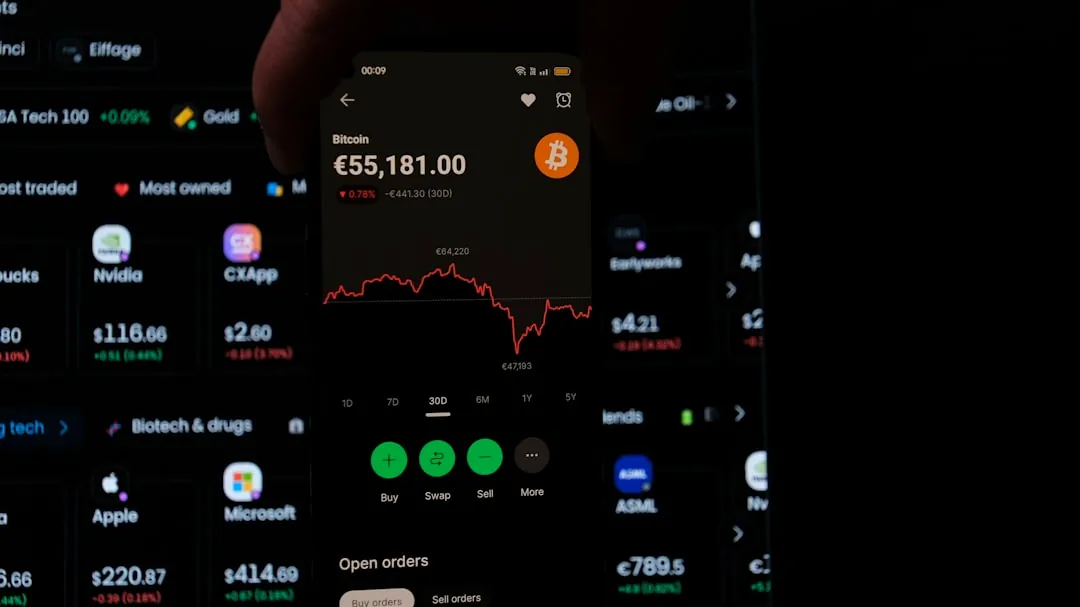 A person holding a cell phone in their hand