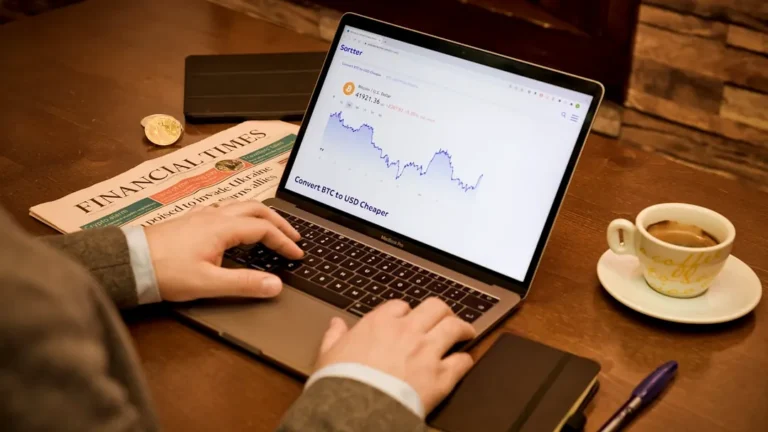 a person typing on a laptop on a table