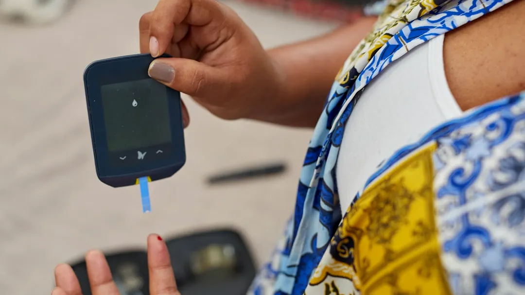 a person using a gluco-meter