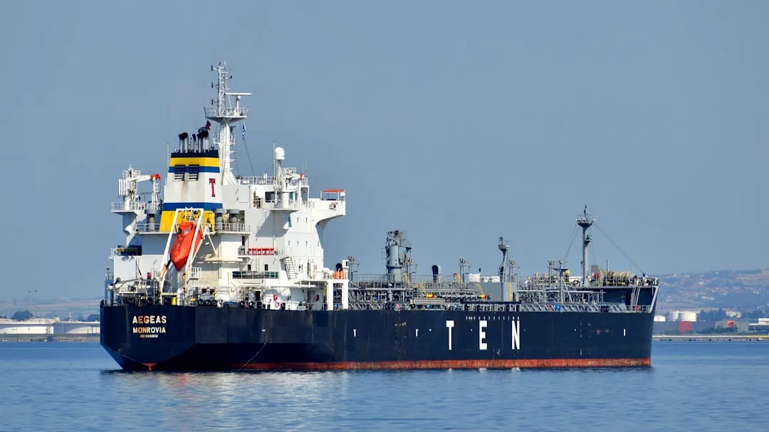 black and white ship on sea under gray sky during daytime