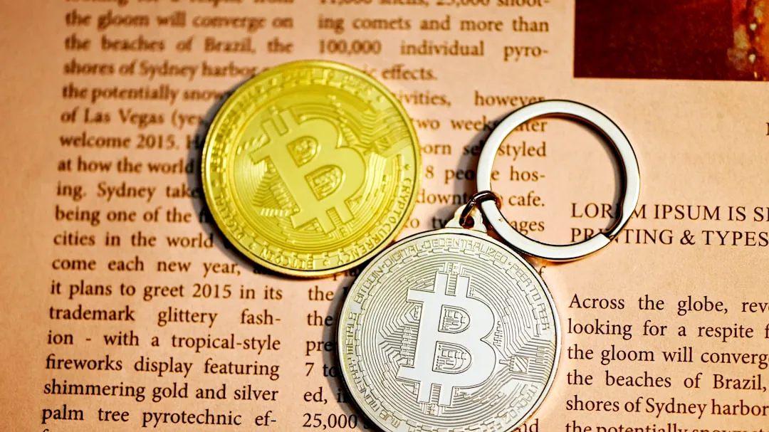 gold round coin on brown paper