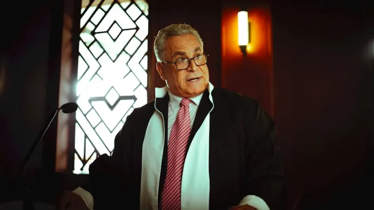 Middle-Eastern judge wearing traditional attire in a courtroom, Baghdad, Iraq.