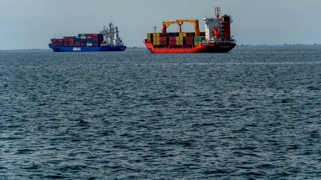a couple of large ships floating on top of a large body of water