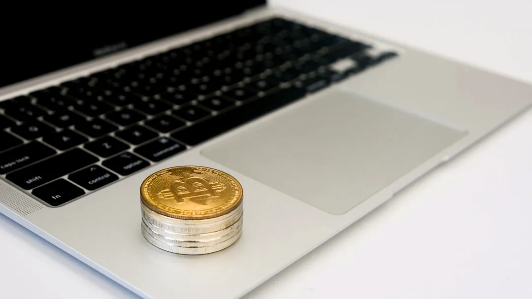 a laptop computer sitting on top of a white desk