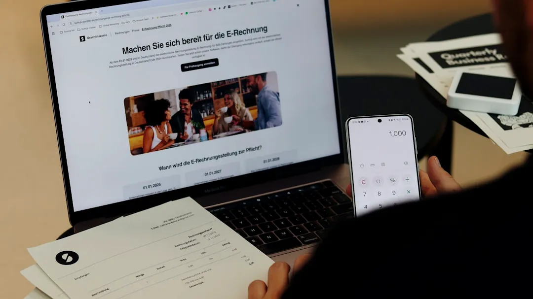 A man sitting in front of a laptop computer