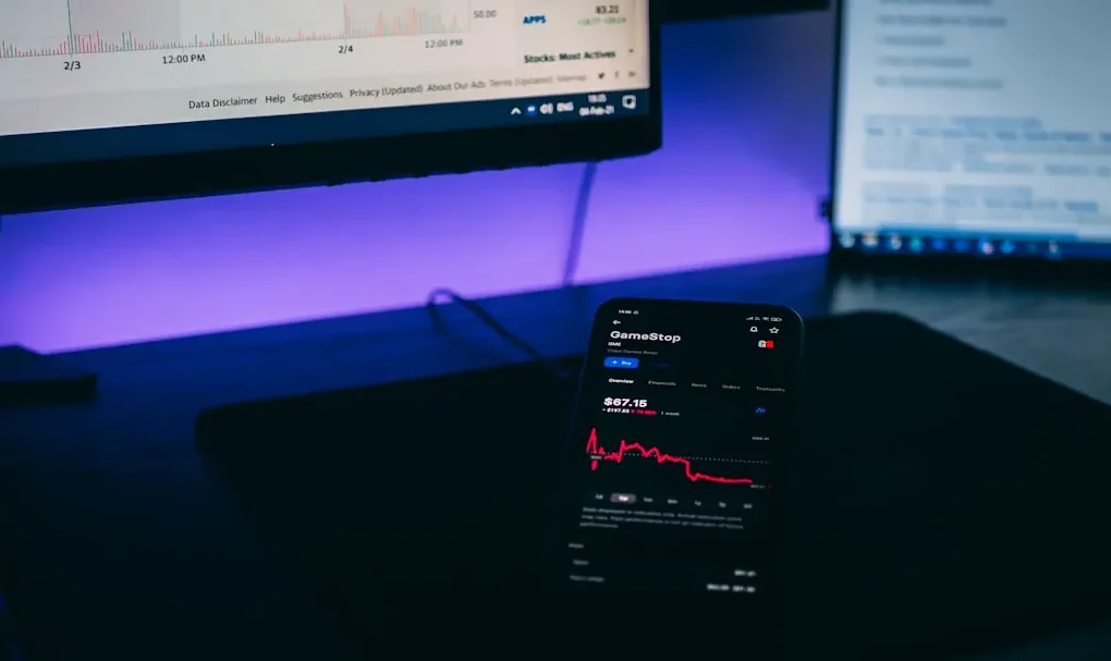 black android smartphone on black laptop computer