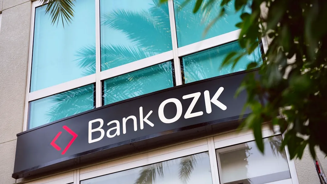a branch of a bank with a palm tree in front of it