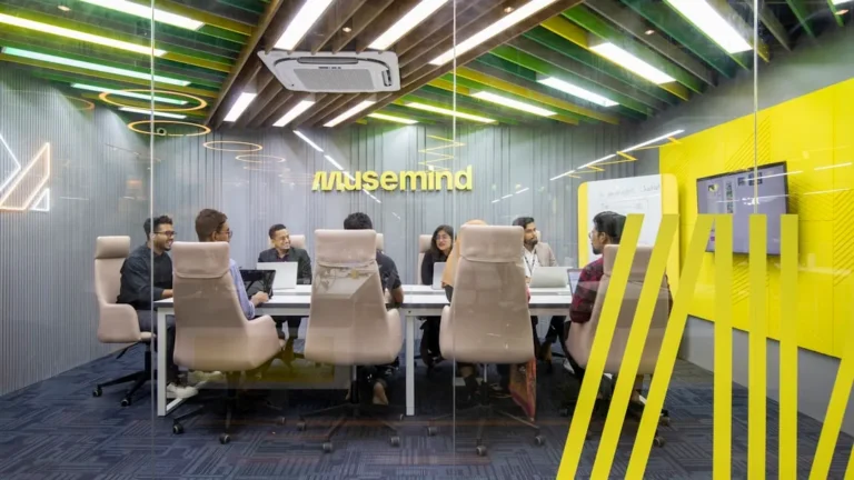 a group of people sitting around a table
