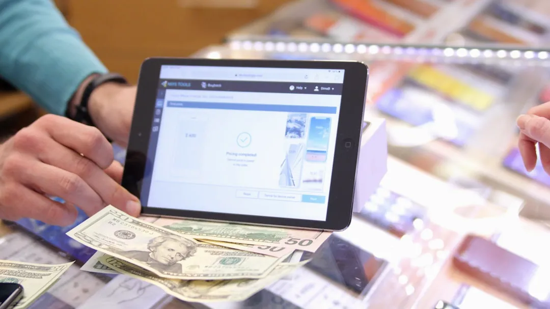 a person holding a tablet in their hands