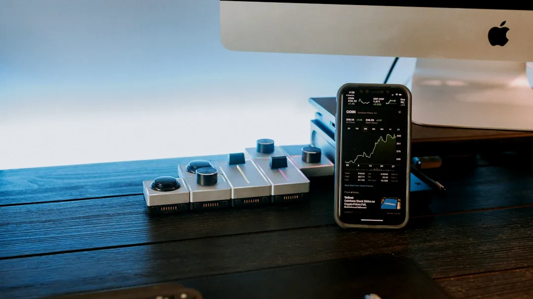 a remote control sitting next to a computer monitor