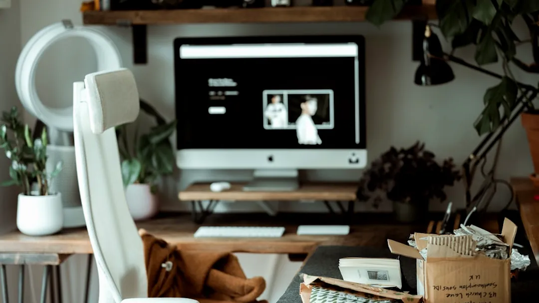 black flat screen tv on brown wooden tv rack